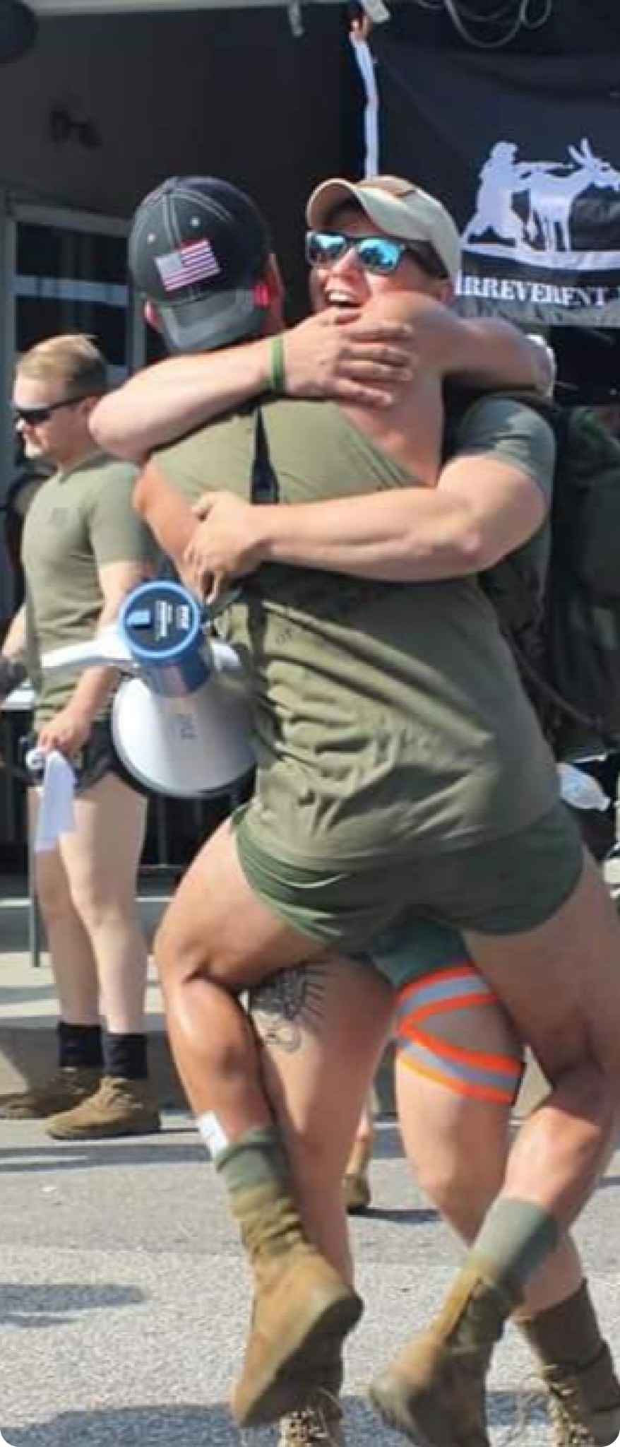 Two service members embracing at MCON