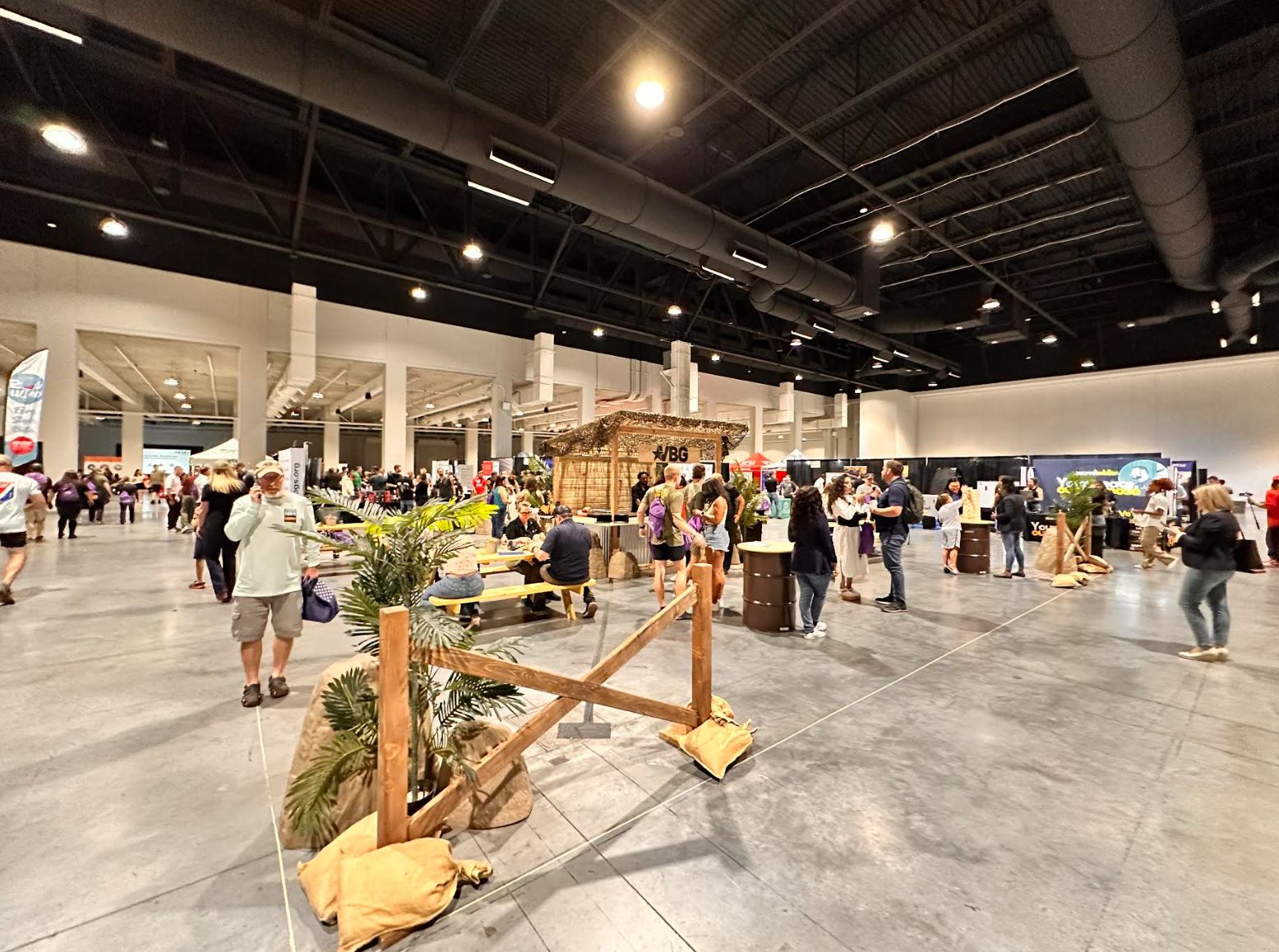 A busy MCON 2025 expo floor, with attendees walking between booths