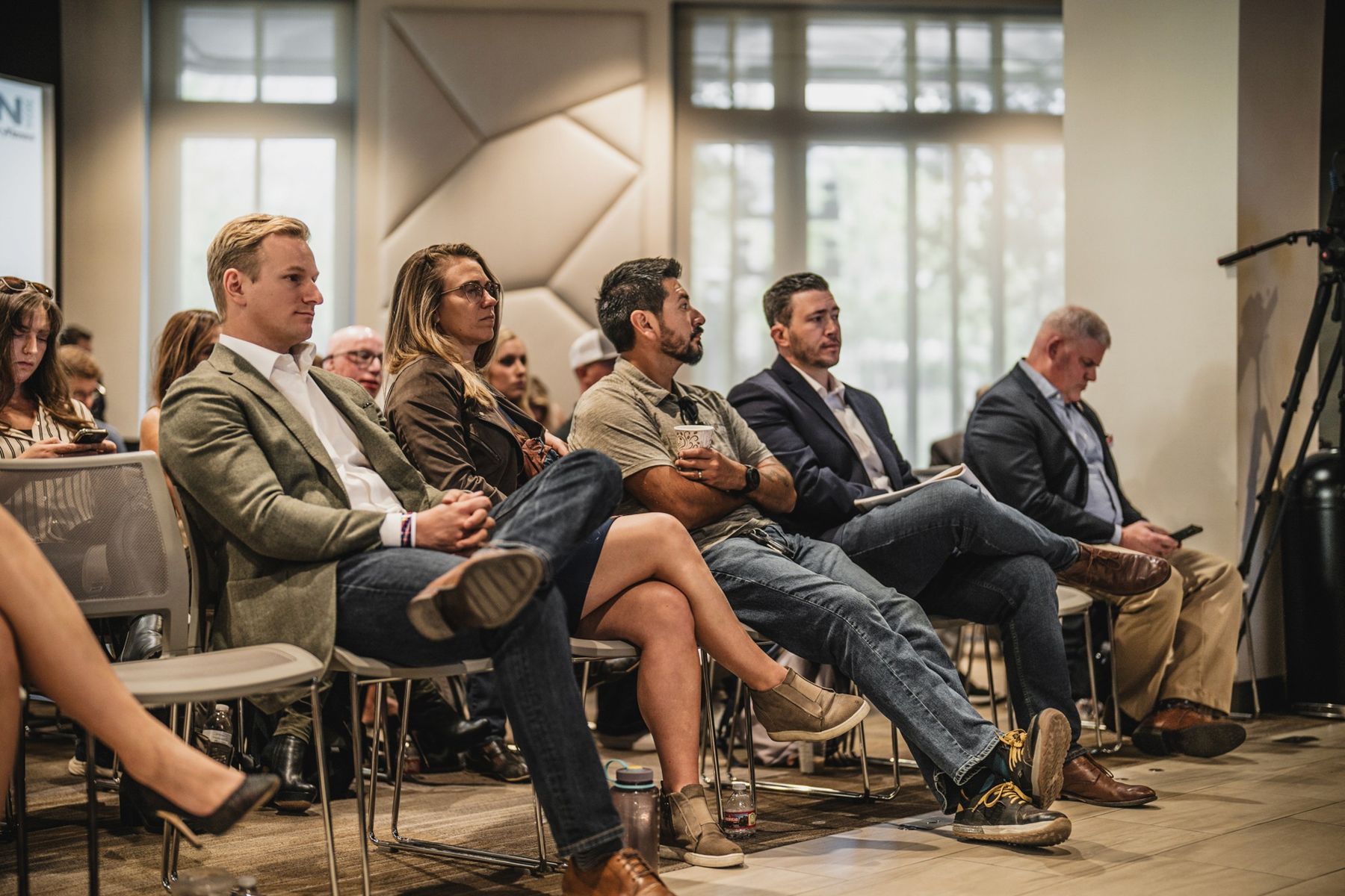 Attendees listening to a panel at an MCON summit